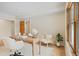 Bright home office with desk, seating, hardwood floors, and a window with snow covered trees view at 342 Brook Cir, Boulder, CO 80302