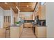 Bright kitchen with stainless steel appliances, light wood cabinets, and a breakfast bar at 342 Brook Cir, Boulder, CO 80302