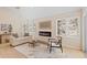 Inviting living room with a sleek fireplace, comfortable seating, and scenic outdoor views at 342 Brook Cir, Boulder, CO 80302