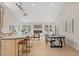Open-concept living room with a fireplace, a dining table, and a kitchen island at 342 Brook Cir, Boulder, CO 80302