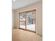 Room with sliding glass doors leading to an outdoor deck with beautiful winter views at 342 Brook Cir, Boulder, CO 80302