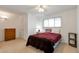 Bedroom featuring a ceiling fan, a cozy bed, and a window with blinds for controlled natural light at 9207 E Mansfield Ave, Denver, CO 80237