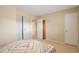 Inviting bedroom with a cozy bed, large closet, and neutral color scheme, perfect for relaxation at 9207 E Mansfield Ave, Denver, CO 80237