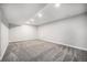 Spacious finished basement with neutral carpet and recessed lighting at 8626 W Utah Ave, Lakewood, CO 80232