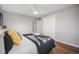 Comfortable bedroom featuring a ceiling fan, closet, and a calming color scheme for relaxation at 8626 W Utah Ave, Lakewood, CO 80232