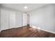 Bedroom featuring wood floors, a ceiling fan, and a closet at 8626 W Utah Ave, Lakewood, CO 80232