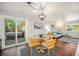 Dining area adjacent to the living room, with a sliding glass door to the outdoor hot tub at 8626 W Utah Ave, Lakewood, CO 80232