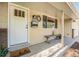 Inviting front entrance with a white door, decorative wreath, and a charming welcome mat at 8626 W Utah Ave, Lakewood, CO 80232