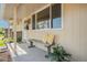 A cozy front porch with bench seating, decorative pillows, and a welcoming entrance at 8626 W Utah Ave, Lakewood, CO 80232