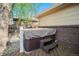 Outdoor hot tub on wooden deck, steps for entry, privacy fence at 8626 W Utah Ave, Lakewood, CO 80232