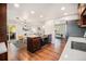 Modern kitchen with stainless steel appliances, an island cooktop, and ample cabinet space at 8626 W Utah Ave, Lakewood, CO 80232