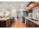Open kitchen concept featuring stainless steel appliances and a view into the adjacent living area at 8626 W Utah Ave, Lakewood, CO 80232
