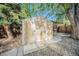 Storage shed in backyard, side walkway, gravel landscaping, and fencing at 8626 W Utah Ave, Lakewood, CO 80232