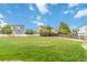 Wide view of a large backyard with lush grass, perfect for recreation and relaxation at 10870 Crestone Needles Dr, Parker, CO 80138