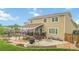 Backyard features a spacious deck, a patio with seating, grill, and lush landscaping at 10870 Crestone Needles Dr, Parker, CO 80138