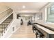 Spacious finished basement with exercise equipment and a shuffleboard table at 10870 Crestone Needles Dr, Parker, CO 80138