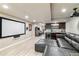 Large finished basement offers a entertainment area, theatre screen, bar, and a sofa at 10870 Crestone Needles Dr, Parker, CO 80138
