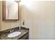 A cozy bathroom with a modern sink, vanity, and mirror at 10870 Crestone Needles Dr, Parker, CO 80138