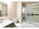 Bright bathroom features a shower over tub, tile surround, and modern vanity with stainless faucet at 10870 Crestone Needles Dr, Parker, CO 80138