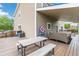 Back deck with dining table and view of the yard with privacy fence at 10870 Crestone Needles Dr, Parker, CO 80138