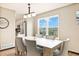 Bright dining area with a large window, modern light fixture and seating at 10870 Crestone Needles Dr, Parker, CO 80138