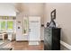 Welcoming entryway showcasing light-filled interiors and elegant wood flooring at 10870 Crestone Needles Dr, Parker, CO 80138