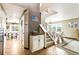Warm foyer featuring wood floors, an open staircase, and a stylish decor niche at 10870 Crestone Needles Dr, Parker, CO 80138