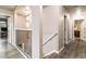 An upstairs hallway provides access to the staircase and bedrooms at 10870 Crestone Needles Dr, Parker, CO 80138