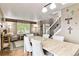 Open-concept living space featuring modern flooring, seating, and natural light at 10870 Crestone Needles Dr, Parker, CO 80138