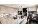 A spacious living room that is partially used as a home office at 10870 Crestone Needles Dr, Parker, CO 80138