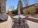 A backyard featuring an outdoor dining set with an umbrella on a wooden deck at 6970 E Lake Dr, Centennial, CO 80111