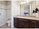 Elegant bathroom with granite countertops, modern vanity, and a glass-enclosed shower at 6970 E Lake Dr, Centennial, CO 80111