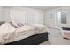 Cozy bedroom with carpet, neutral walls, and a bed with drawer storage at 6970 E Lake Dr, Centennial, CO 80111