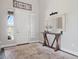 Inviting entryway with a decorative mirror, a console table, and natural lighting at 6970 E Lake Dr, Centennial, CO 80111