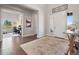 Open entryway with hardwood floors leading to a home office and a view of the front door at 6970 E Lake Dr, Centennial, CO 80111