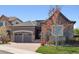 Charming home with stone accents, three-car garage, and beautiful landscaping at 6970 E Lake Dr, Centennial, CO 80111
