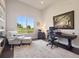 Bright home office featuring a large window with views of the outdoors and built-in bookshelves at 6970 E Lake Dr, Centennial, CO 80111