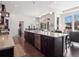 Modern kitchen featuring a large center island, stainless steel appliances, and hardwood flooring at 6970 E Lake Dr, Centennial, CO 80111