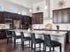 Modern kitchen with a large center island, stainless steel appliances, and custom cabinetry at 6970 E Lake Dr, Centennial, CO 80111
