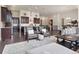 Bright living room with open floor plan, kitchen in the background, and comfortable seating at 6970 E Lake Dr, Centennial, CO 80111