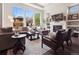 Comfortable living room features fireplace, large windows, modern decor, and ample seating at 6970 E Lake Dr, Centennial, CO 80111
