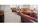 Comfortable living room featuring leather sofas, throw pillows, and a central coffee table at 6970 E Lake Dr, Centennial, CO 80111