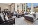 Bright living room features large windows, stone accents, comfortable seating, and modern decor at 6970 E Lake Dr, Centennial, CO 80111