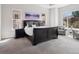 Spacious main bedroom featuring a trey ceiling, multiple windows, and a cozy sitting area at 6970 E Lake Dr, Centennial, CO 80111