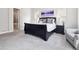 Spacious main bedroom with plush carpeting, large windows, and stylish furniture at 6970 E Lake Dr, Centennial, CO 80111