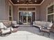 Covered outdoor patio with comfortable seating and a ceiling fan at 6970 E Lake Dr, Centennial, CO 80111
