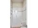 Clean and modern shower with glass door, tiled walls, and a built-in bench at 6970 E Lake Dr, Centennial, CO 80111