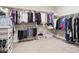 Spacious walk-in closet with ample shelving, hanging rods, and organized storage solutions at 6970 E Lake Dr, Centennial, CO 80111