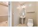 A half bathroom features a pedestal sink at 1827 N Grant St # 800, Denver, CO 80203