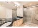 A contemporary bathroom boasts a glass shower, double sinks, and neutral tile at 1827 N Grant St # 800, Denver, CO 80203